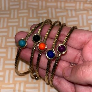 Set of five gold bangles- green, black, orange, blue, purple